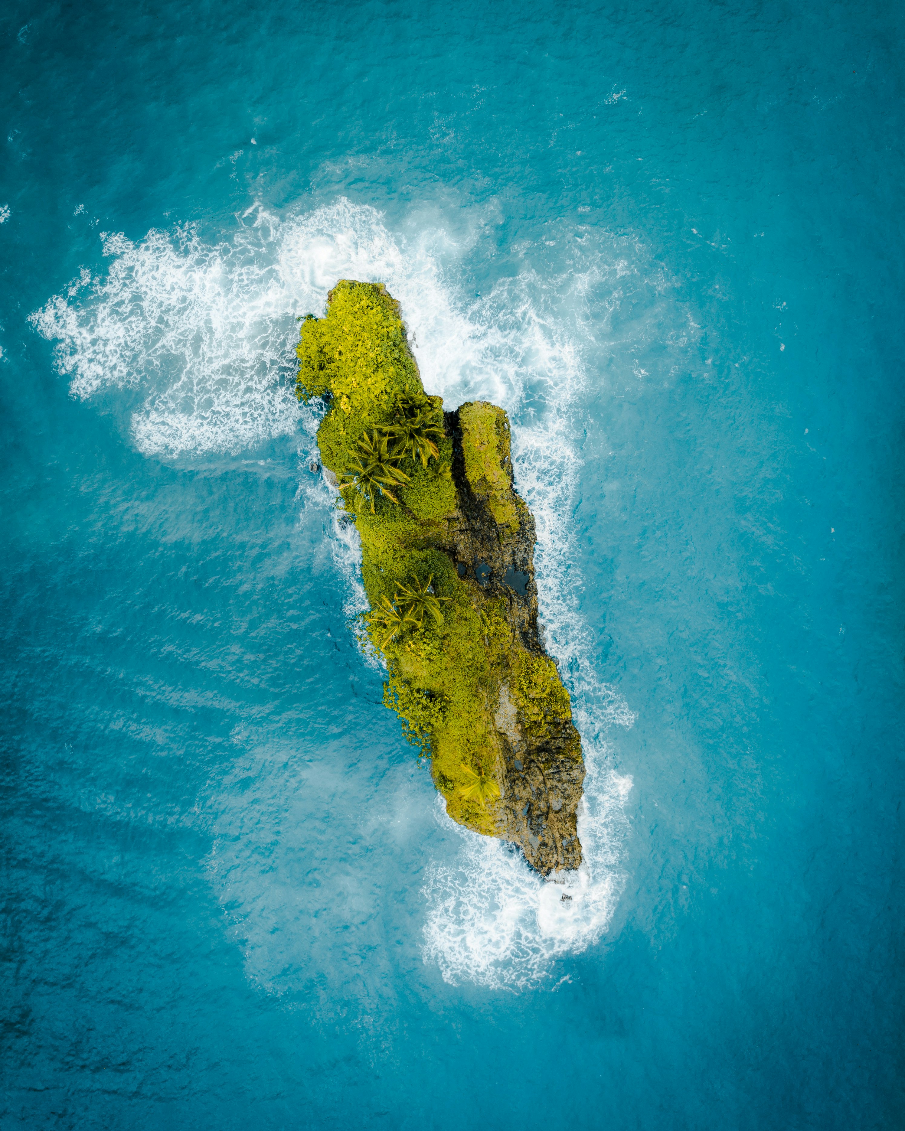 green island surrounded by body of water